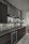 Retail Interior Design Sales Gallery Model Dark Colors Backsplash